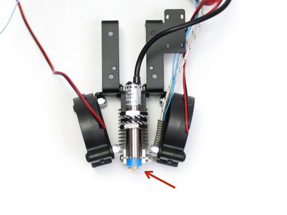 The bottom of the probe should be between 1-2mm above the tip of the nozzle.