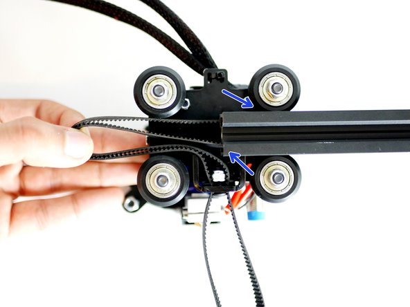Slide the Y-Carrriage onto the extrusion half way, make sure the belt is trapped between both the upper and lower grooves of the extrusion.