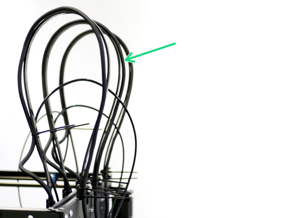 With the USB cable following the guide, secure them both to the dock bracket as shown.