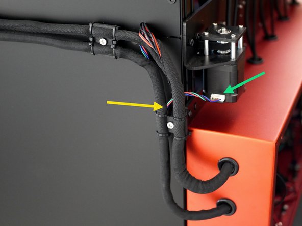 Feed the cable through the cooling fan loom and into the electronics box from the rear.
