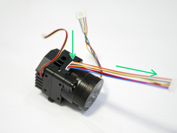 Plug the IO cable into the Extruder and bend it towards the motor.