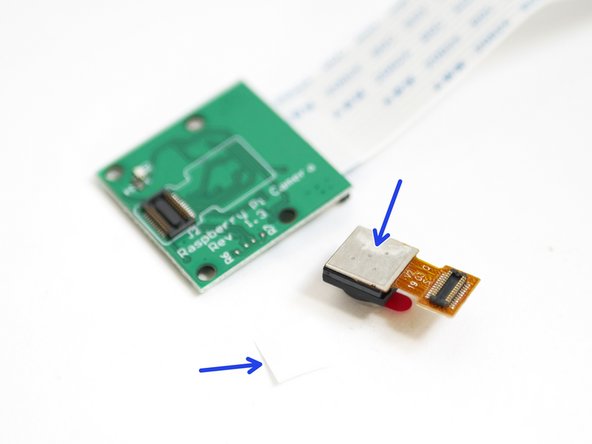 Peel away the protective layer from the sticky pad underneath the camera module.