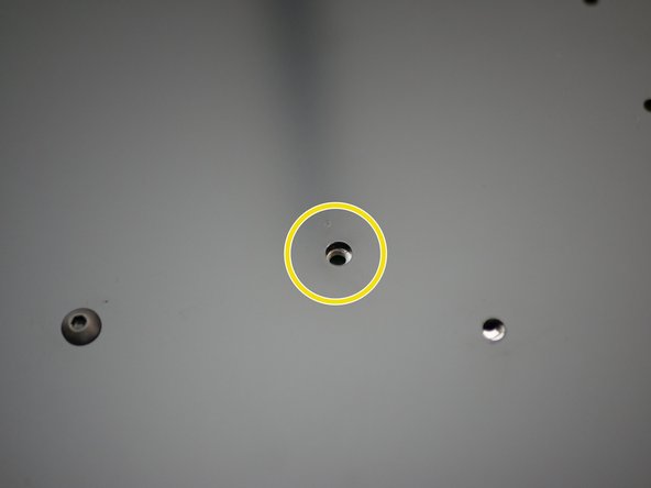 Align the 4mm holes on the back of the power supply with the four 4mm holes on the base.