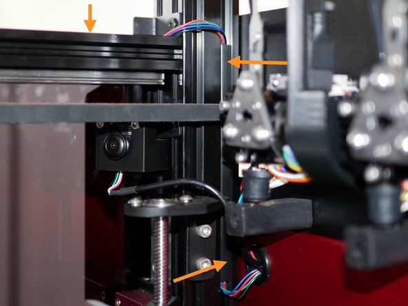 Cut a small strip of the cable cover to route the cable behind the belts.