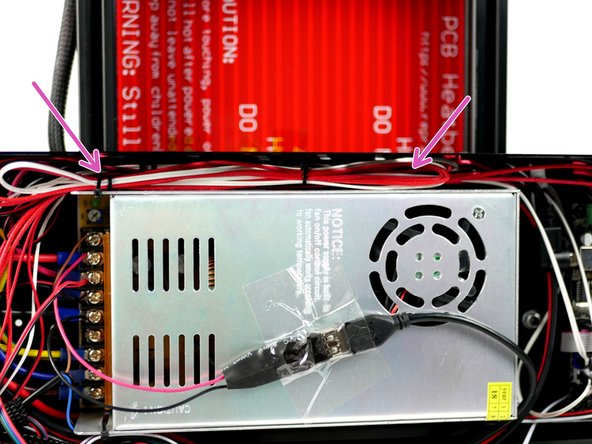 Tuck the cables in between the side panel and power supply.