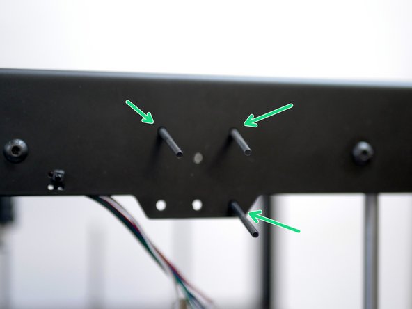 Feed them into holes on the top panel, from the inside.