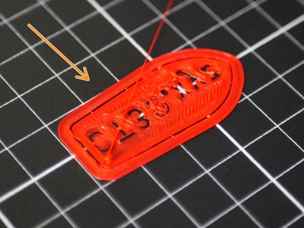 Too high - the first layer isn't sticking or the model has peeled off.