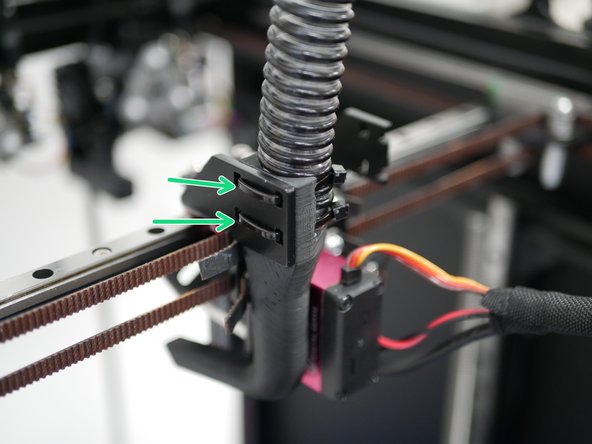 Fix the fan shroud to the carriage bracket with two cable ties.