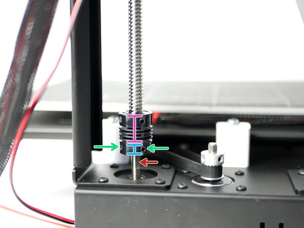 Secure the coupling onto the z-motor shaft by tightening the two grub screws.