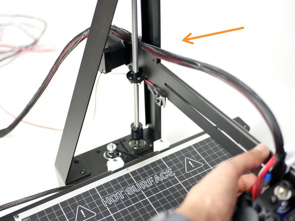 Fix the gantry into position like shown with the eccentric guides against the back of the z-pillar rail.