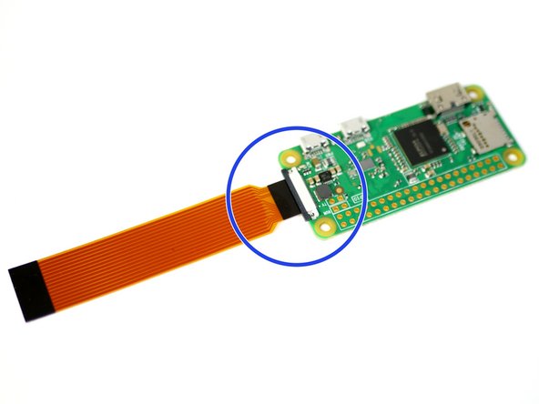 Pull back the black bar on the connector.