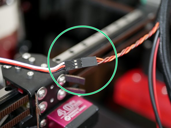 Attach to the servo cable to the servo extension cable.