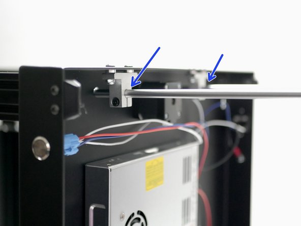Slide two z-rods in through the mounts on the base.