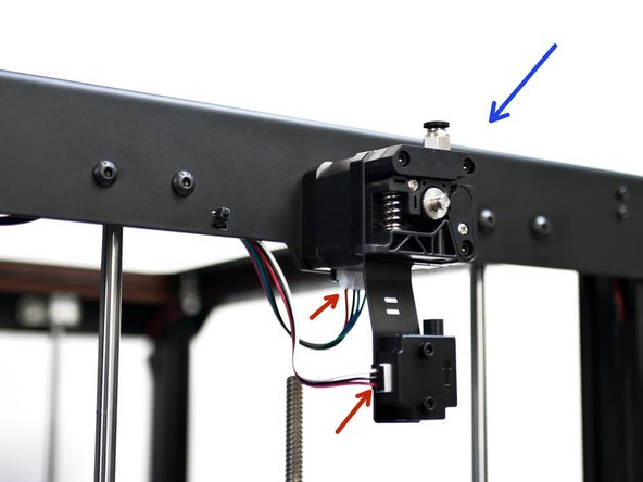 Secure the extruder onto the top panel.