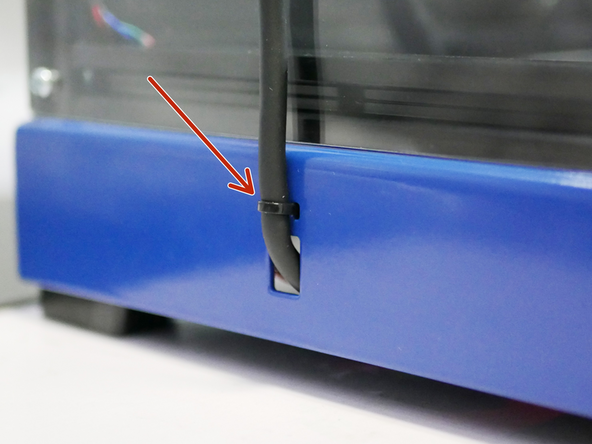 Feed the tool carriage cable loom into the base and use a cable tie to secure it in place.