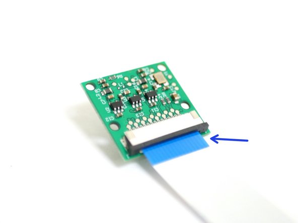 Connect the 60cm ribbon cable to the Pi Cam with the blue tab facing towards you.