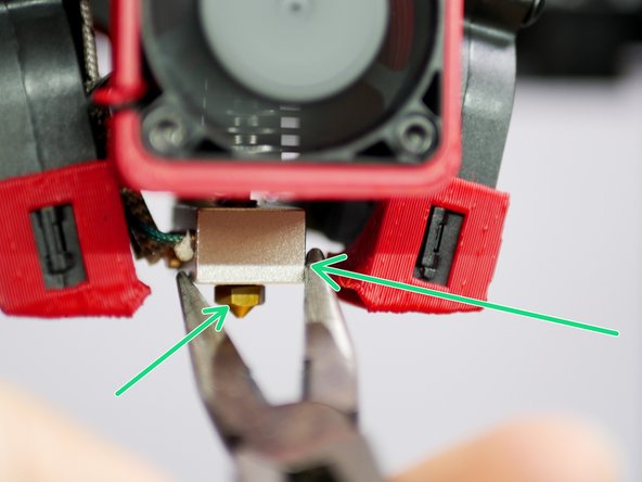 With the hotend hot, hot tighten the nozzle.