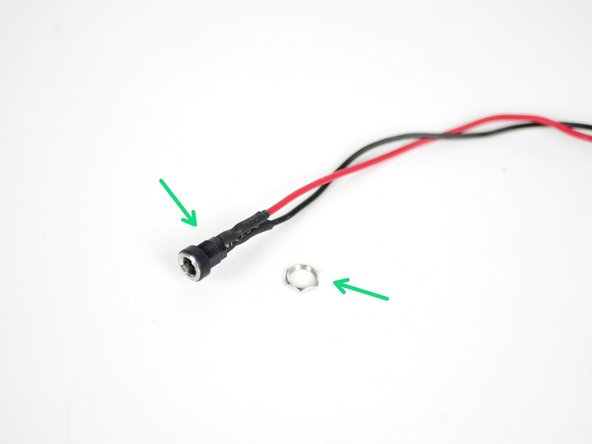 Take the power port mount and remove the nut.