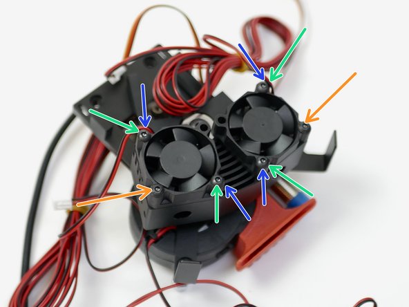 Fix the two 30mm fans onto the heatsink. Orientate the cables as shown.