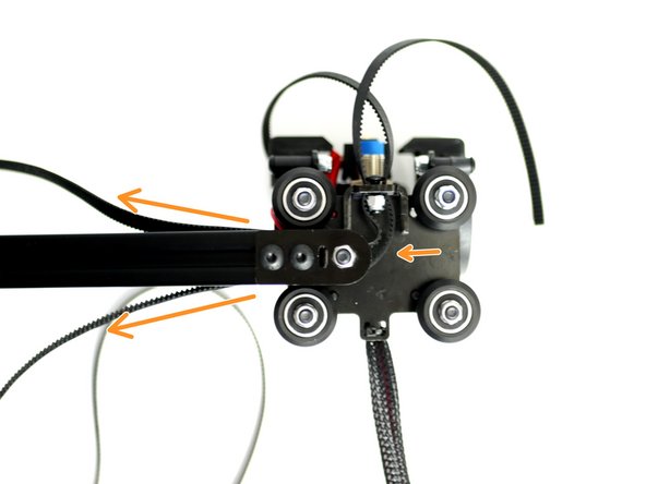 Bring the rollers up to the gantry beam making sure to trap the belt loop in the grooves of the beam with teeth facing inwards.