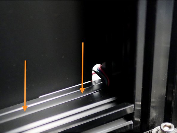 Route the GC motor cable and X-Endstop cable around the rear of the frame and through the panel if you have the enclosure upgrade.