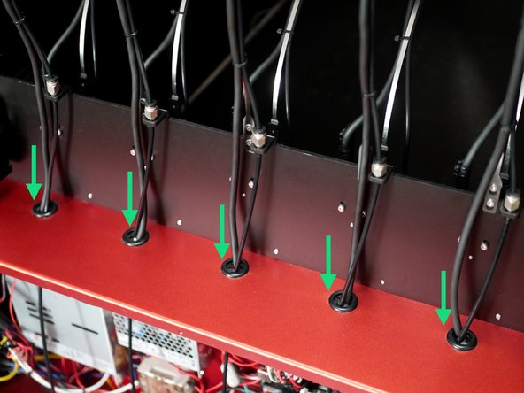 Feed the print head cables and filament tubes into the electronics box.