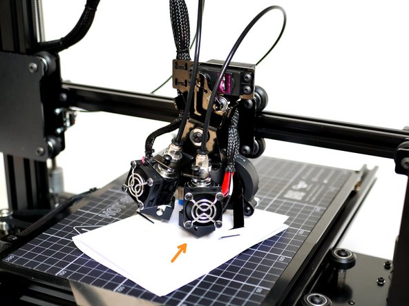 Raise or lower the Hotend in 0.1mm increments until the friction between the paper and nozzle is the same as what the friction between the paper and the nozzle of Hotend #1 was.