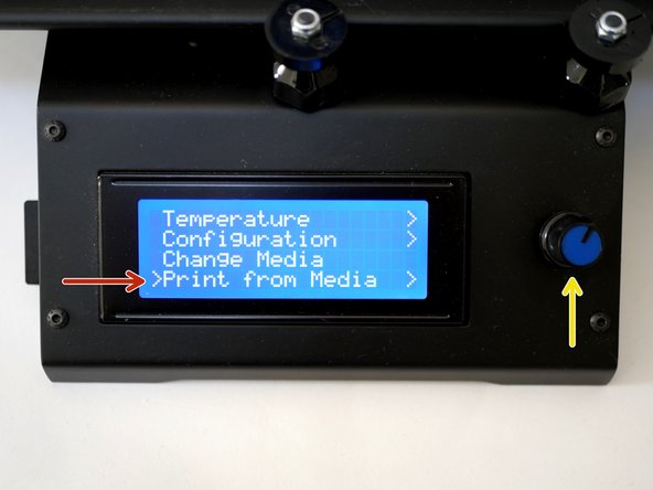 After saving your .gcode to the SD card, slot it into the side of the Axis like shown.