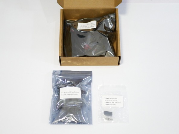 Open the orbiter tool board box and take out the tool board and mounting spacers.