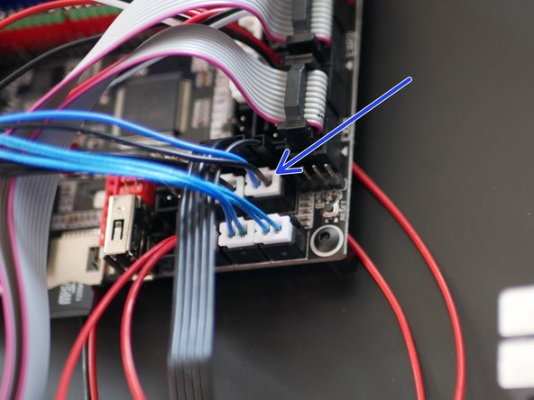 Connect the black and blue cable from the probe to the control board in the position shown.