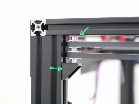 Fix the front idler assemblies to the frame.