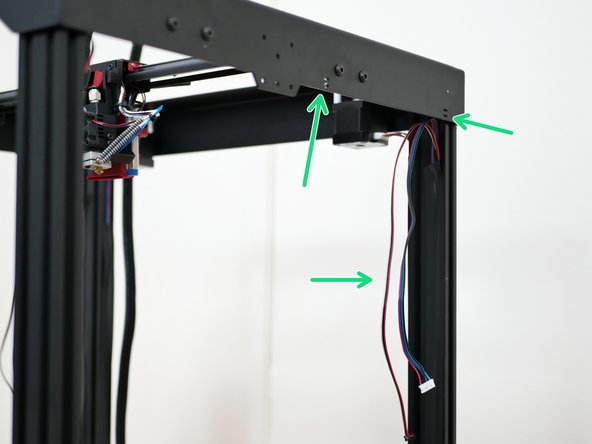 Snip away the cable ties holding the extruder and filament sensor cables to the top panel.