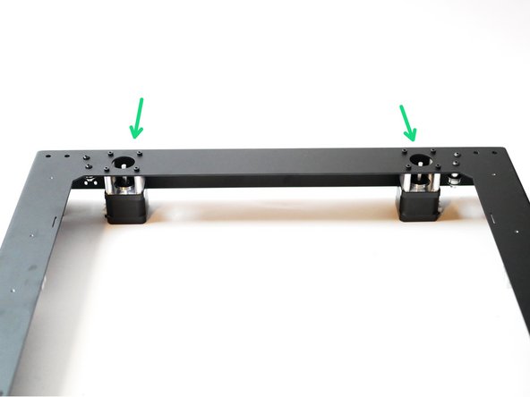 Install the two 0.9 degree stepper motors to the rear of the top panel as shown.