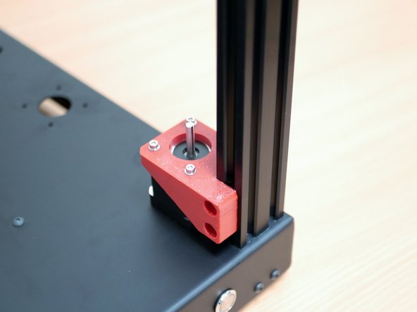 Secure those motor assemblies to the inside front of the frame as shown.