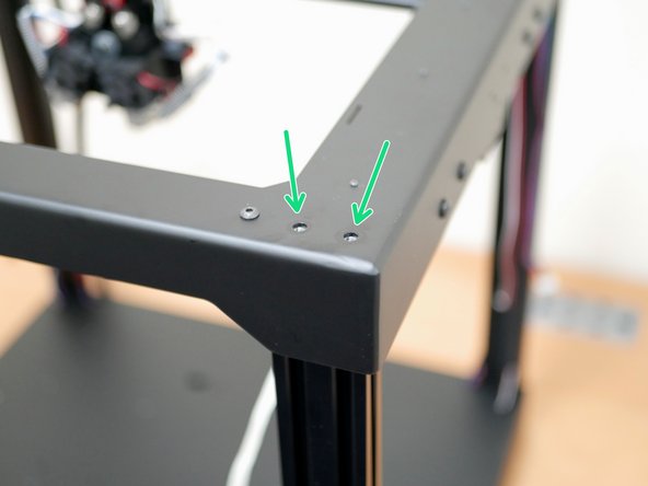 Unfasten the 8x M5 bolts holding the top panel assembly to the extrusions.