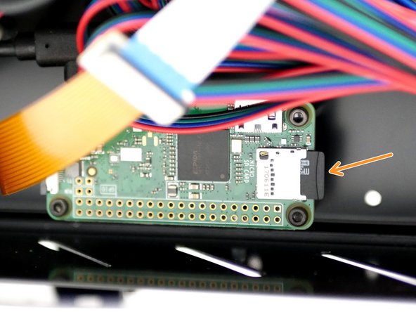 On the Pi Zero W it is inserted on the front.