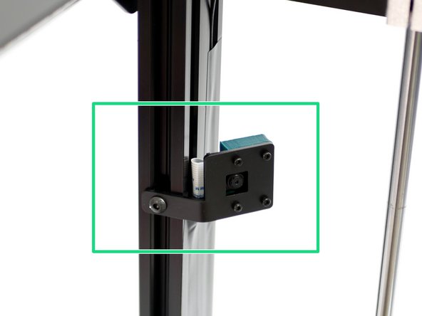 Mount the camera assembly to the frame as shown.