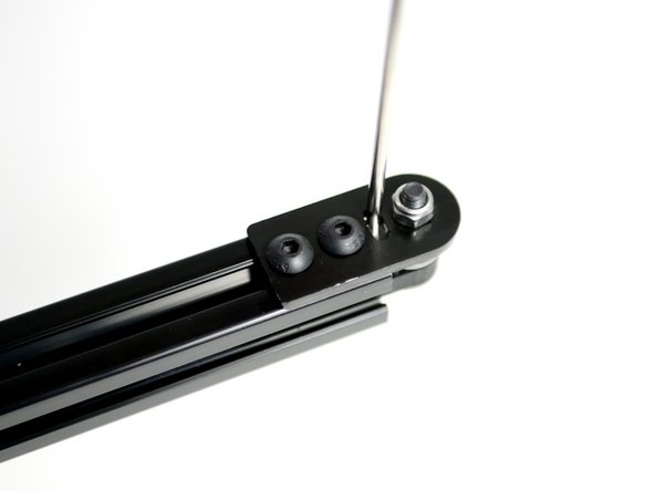 Loosen the bolts holding the the Y-Idler assmebly to the gantry beam.