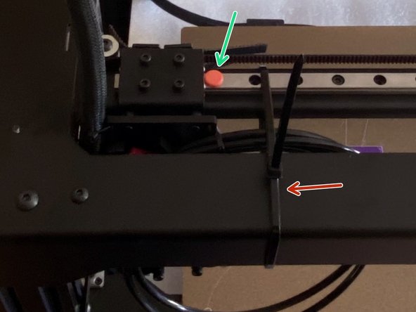 Cut the cable tie holding the gantry.