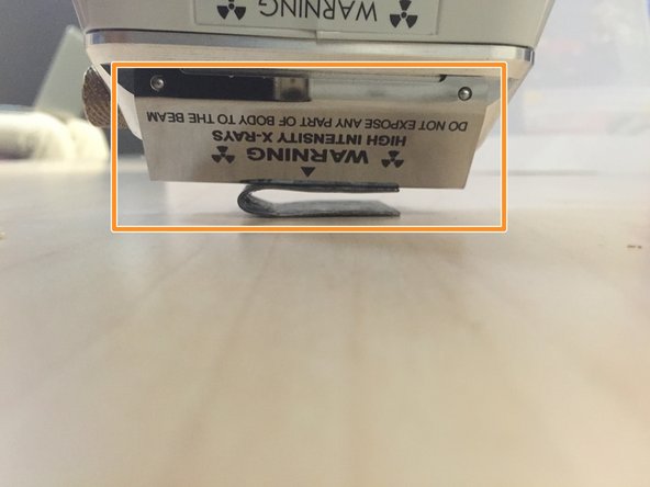 The XRF gun should now be pressed against the sample as shown.