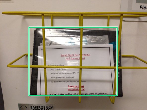 Alert people in the immediate area of the spill.