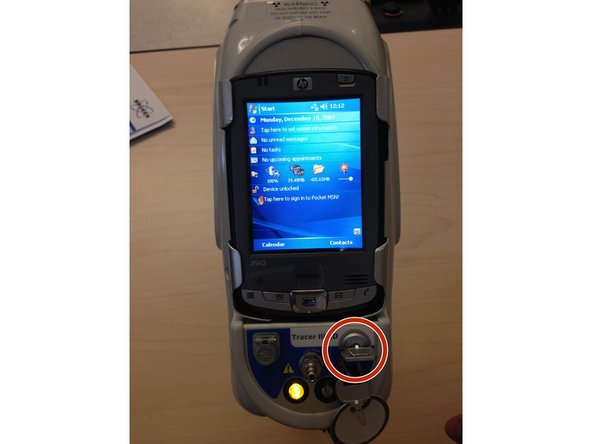 Insert key into slot and turn 90° to the right.