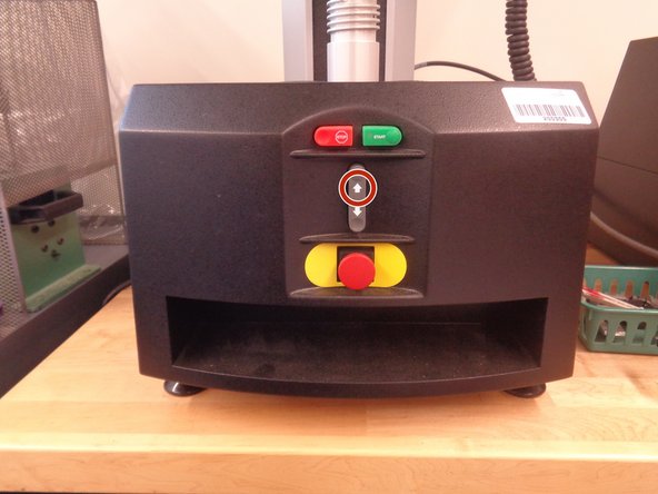 Move the indenter up to give yourself enough room to place the sample by pushing the up arrow located at the front of the machine
