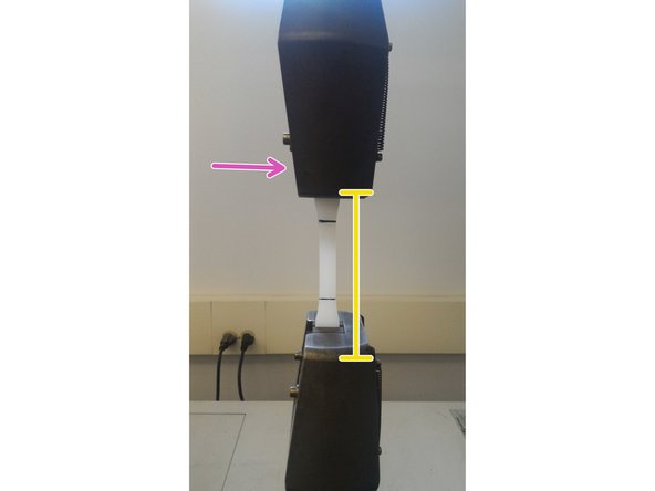 Ensure that the sample is oriented vertically with the machine. Tighten the lower jaw by turning the clamp counter-clockwise &quot;handtight.&quot;