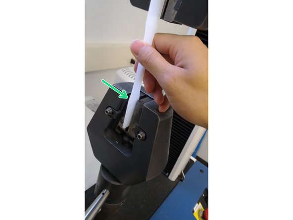 Place the sample into the jaw such that the edge of the grip section is just above the edge of top of the jaw.