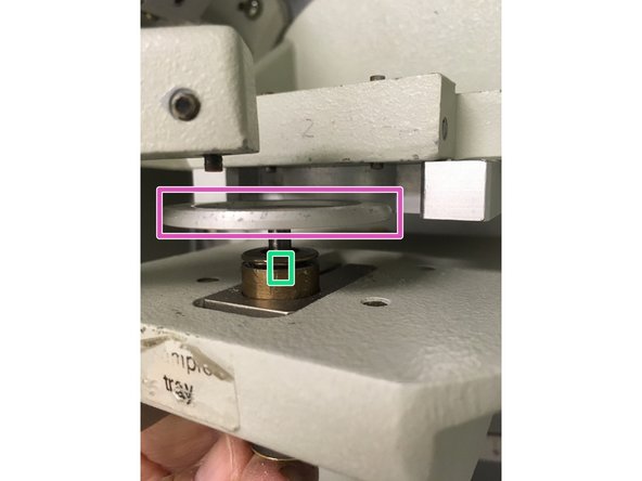 With release engaged, drop stage plunger to lower specimen stage.