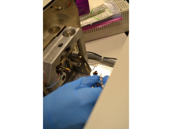 Watch the video screen and slowly open the SEM door with the proper two-handed method.