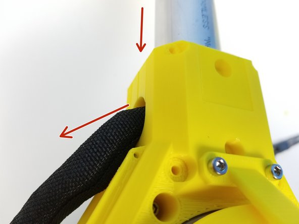 Insert the Pipe into the Shoulder Gearbox and pull the Braided Cable Sleeve out