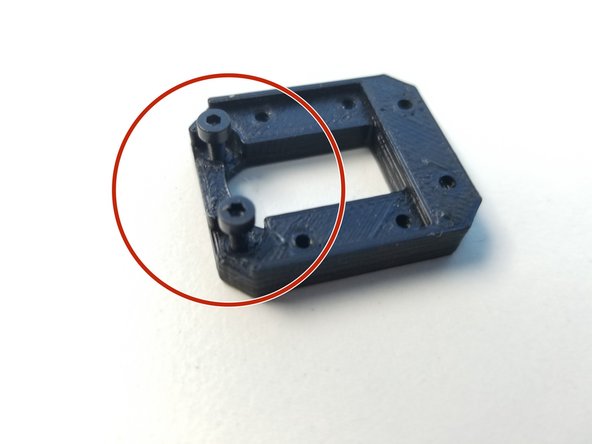 Partially screw in two M2x6mm screws in the Sensor Adapter with the screw head insert.