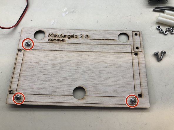 Insert three M3x10 screws in the marked holes and fasten them with one M3 nut each.